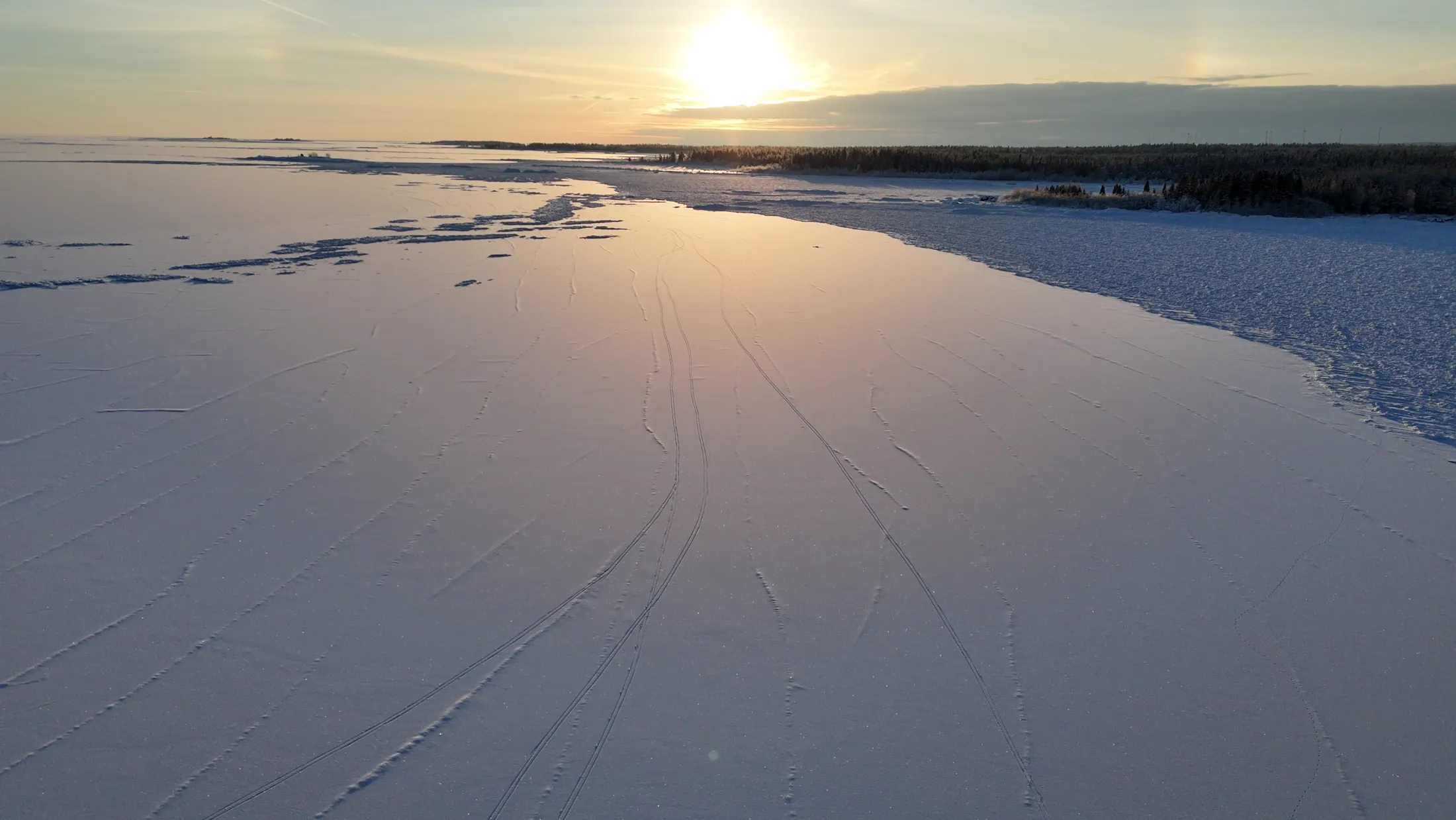 Drone view over the snowy Baltic Sea and winter coast